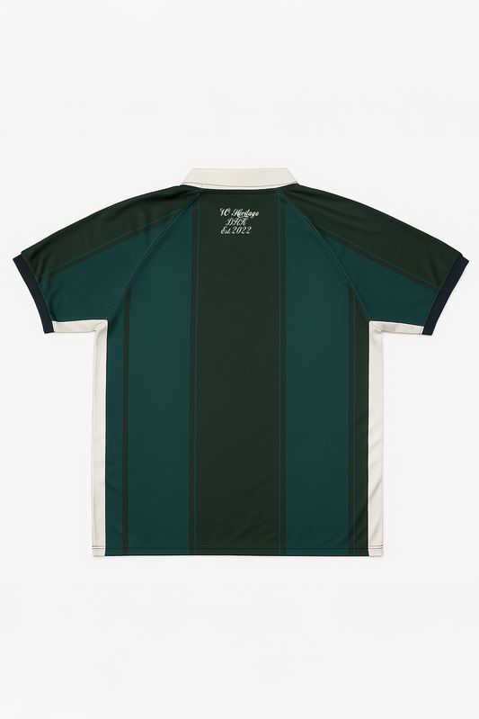 Back view of Version Originale’s green Version Classique jersey with vertical panel detailing, beige collar, and “VO Heritage DHK Est. 2022” script printed on the upper back