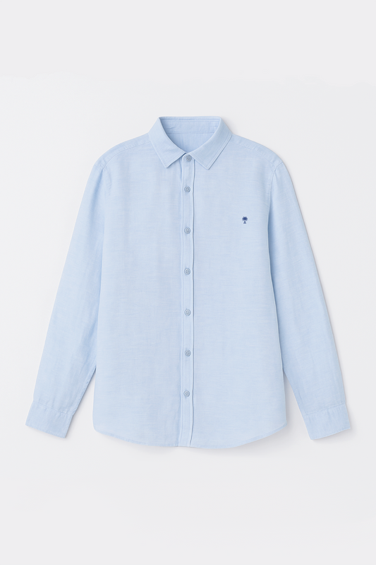 Flat lay of Version Originale’s classic blue linen shirt featuring a full button-down front and a navy blue palm tree embroidery on the chest
