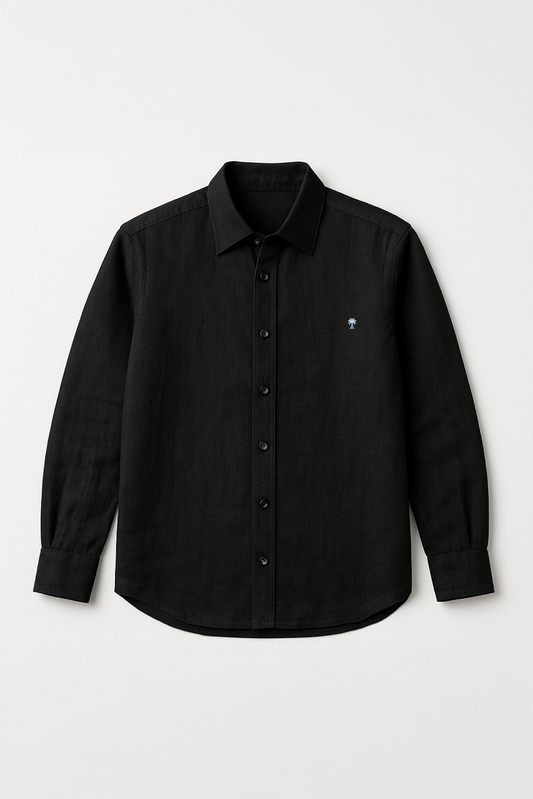 Flat lay of Version Originale's classic black linen shirt featuring a full button-down front and subtle palm tree embroidery on the chest