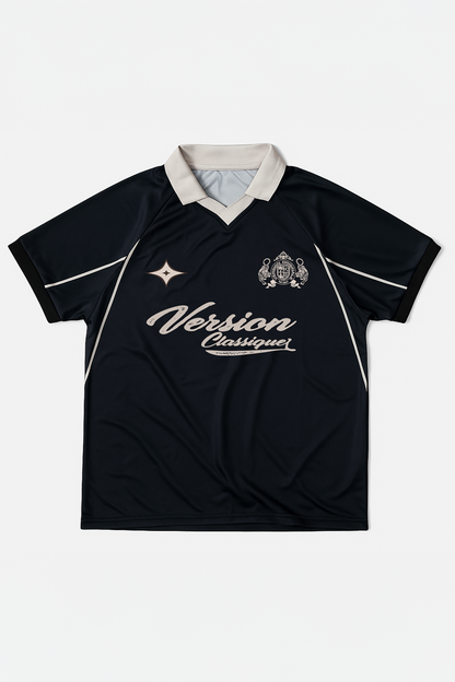 Flat lay of Version Originale’s black retro football jersey featuring a beige “Version Classique” chest print and crest detailing