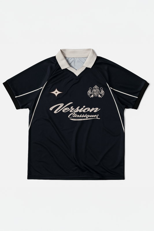 Flat lay of Version Originale’s black retro football jersey featuring a beige “Version Classique” chest print and crest detailing