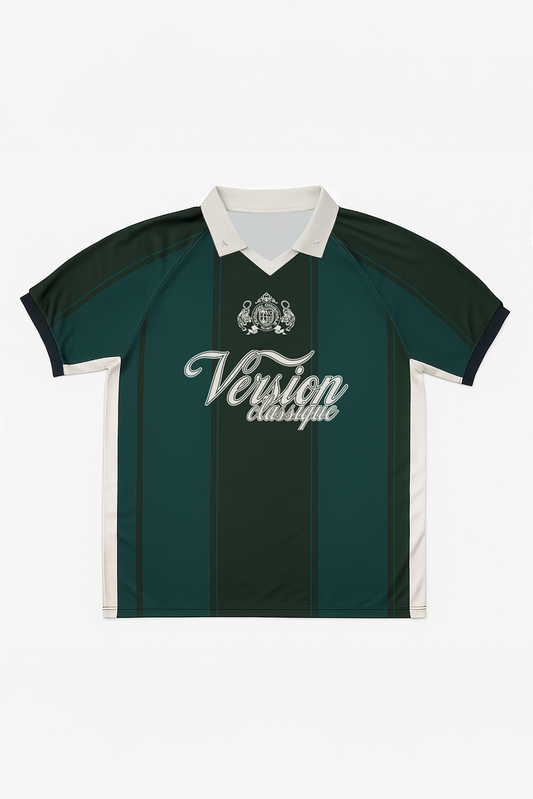 Flat lay of Version Originale’s green Version Classique jersey featuring beige chest print reading “Version Classique” and an embroidered crest on the front